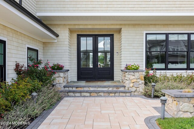 doorway to property featuring french doors