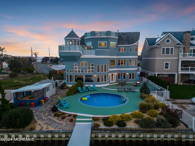 exterior space with a patio and a balcony