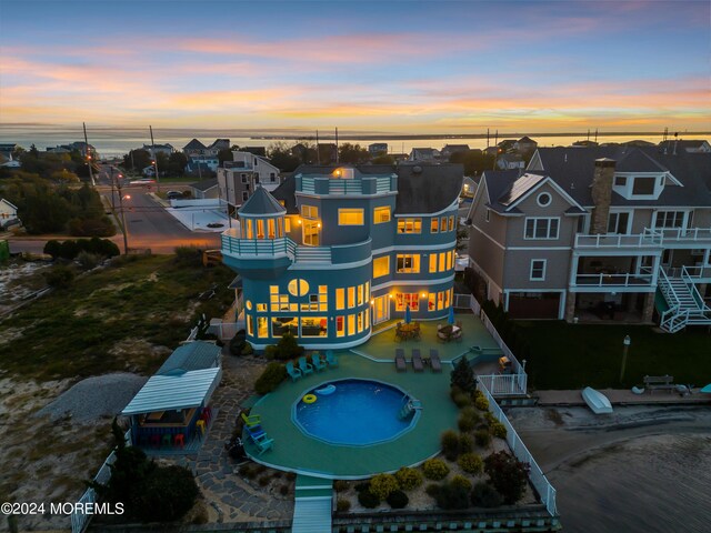 aerial view at dusk with a water view