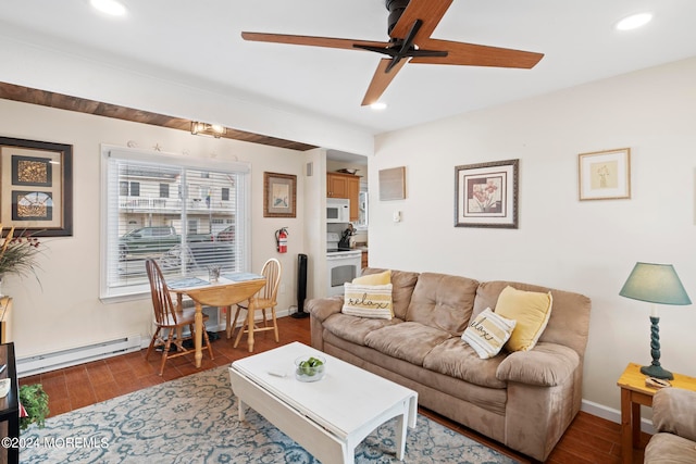 living room featuring dark wood-type flooring, a baseboard radiator, and ceiling fan