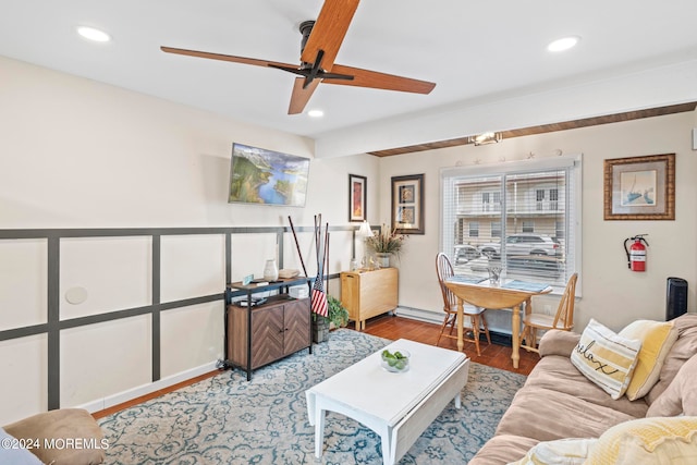 living room featuring ceiling fan and wood-type flooring