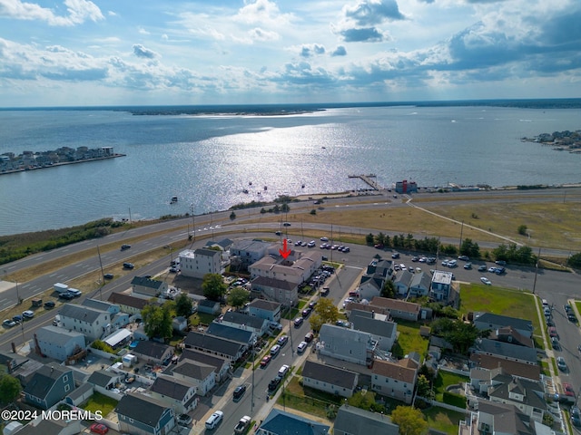 bird's eye view featuring a residential view and a water view