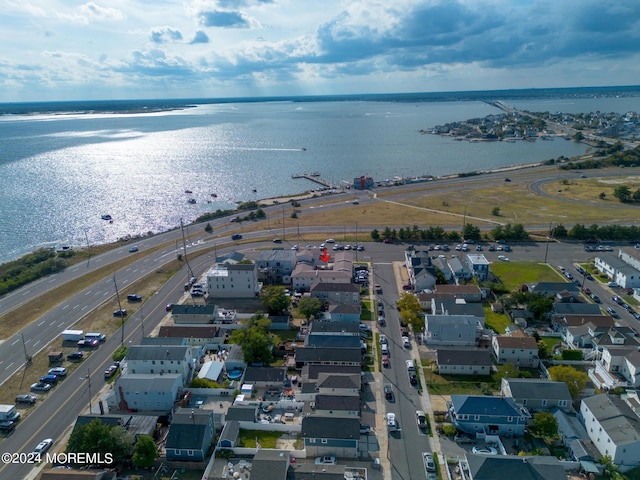 bird's eye view with a residential view and a water view