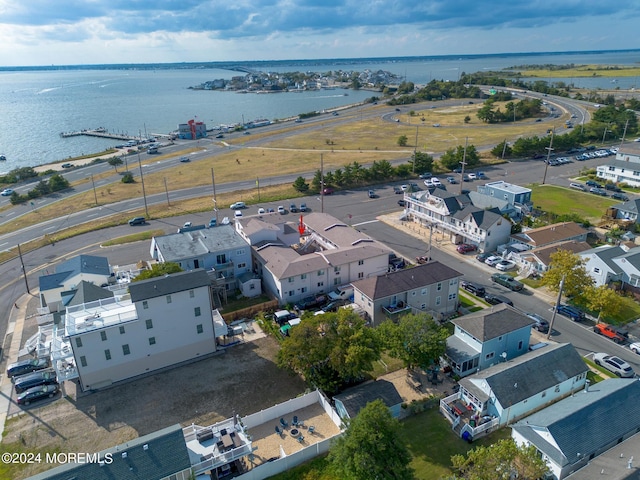 birds eye view of property featuring a residential view and a water view