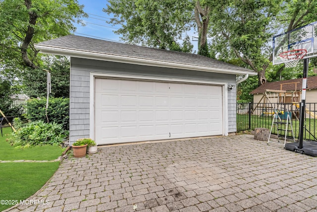 garage featuring a lawn