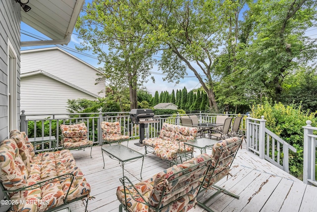 wooden terrace featuring outdoor lounge area