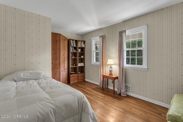 bedroom with hardwood / wood-style floors