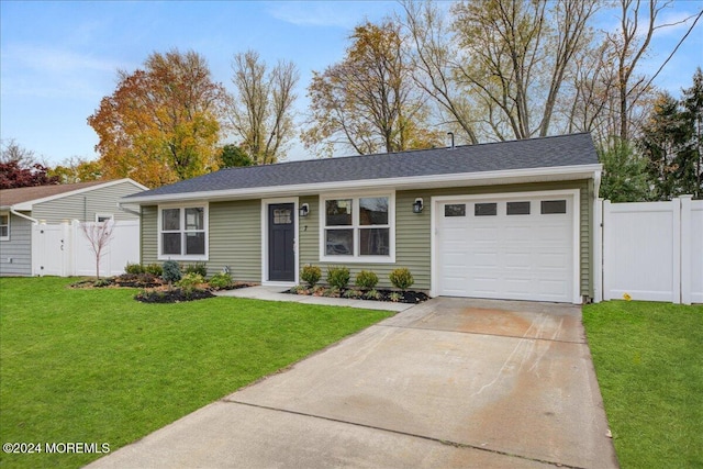 single story home with a garage and a front lawn