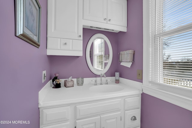 bathroom with plenty of natural light and vanity