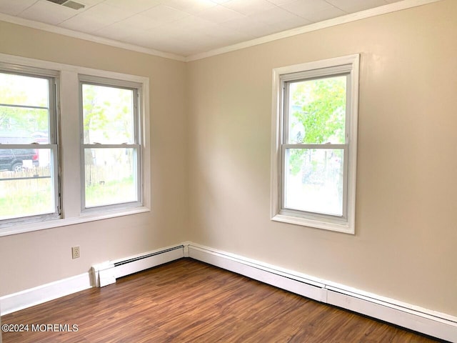 unfurnished room with dark wood-type flooring, baseboards, baseboard heating, and ornamental molding