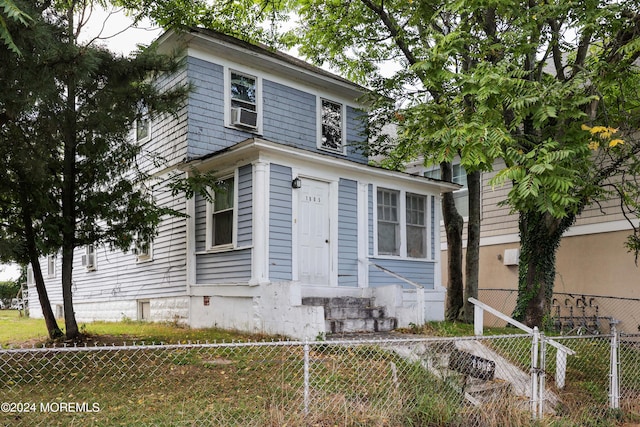 view of front of property featuring cooling unit