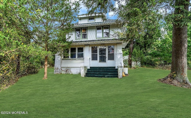 back of house with a yard