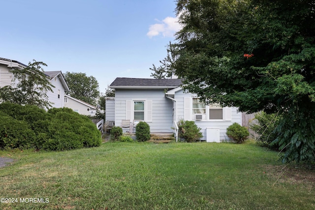 view of front of home with a front yard