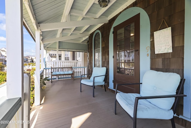 wooden deck featuring covered porch