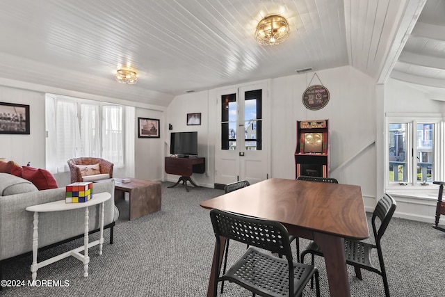 dining space with lofted ceiling, french doors, carpet, and wood ceiling