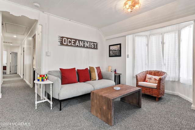 living room featuring lofted ceiling and carpet