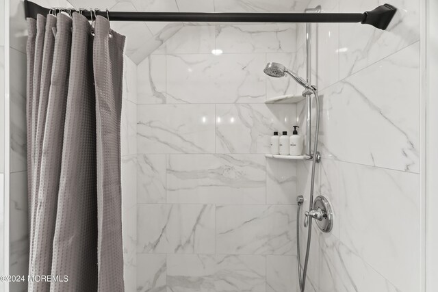 bathroom with a shower with shower curtain