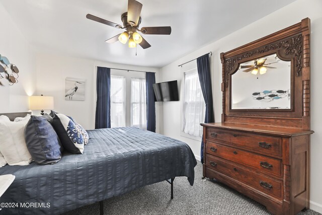 bedroom featuring ceiling fan and carpet floors