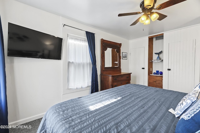 bedroom with ceiling fan, visible vents, and baseboards