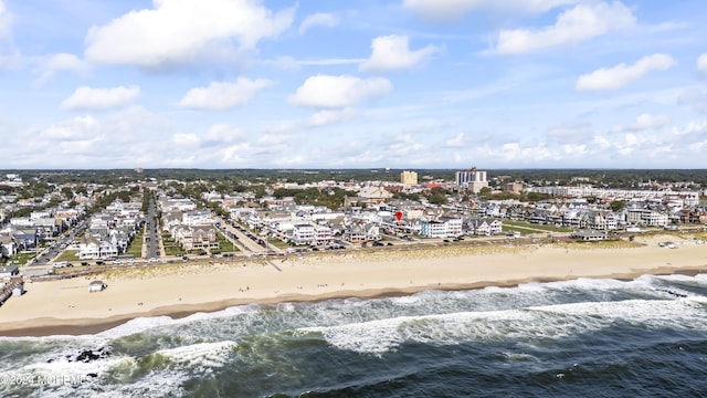 aerial view with a beach view and a water view