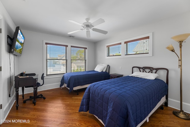 bedroom featuring ceiling fan and dark wood-type flooring