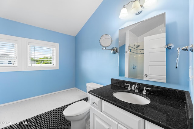 bathroom featuring toilet, tiled shower, vaulted ceiling, tile patterned floors, and vanity