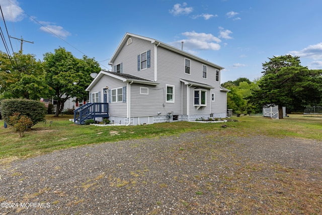 view of side of property with a storage shed