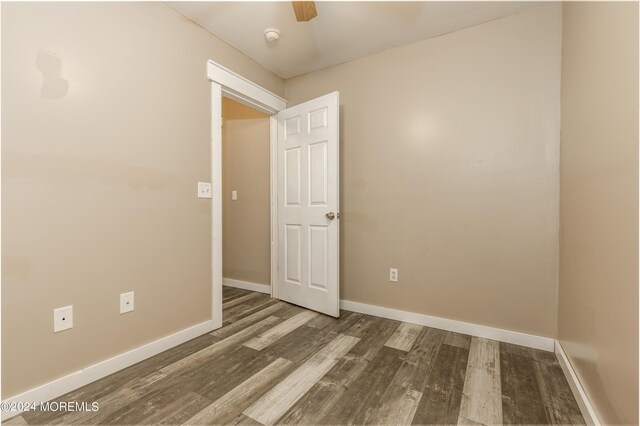 unfurnished room with wood-type flooring and ceiling fan