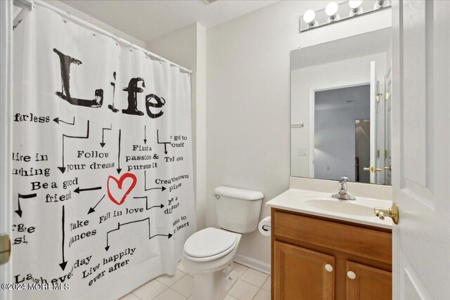 bathroom featuring a shower with shower curtain, tile patterned flooring, toilet, and vanity