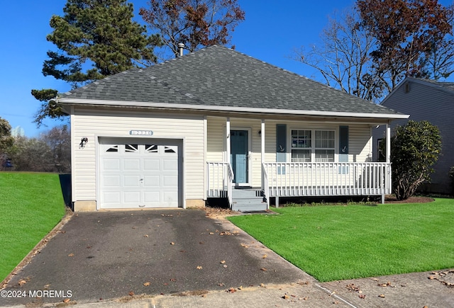 view of front facade with a garage and a front lawn