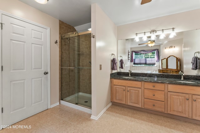 bathroom with vanity, tile patterned floors, ceiling fan, and an enclosed shower