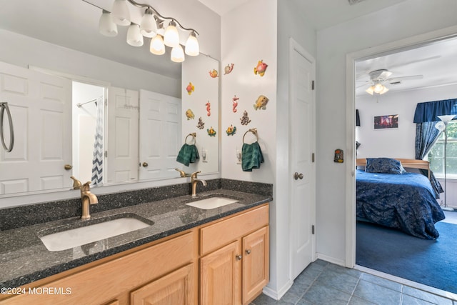 bathroom with ceiling fan, curtained shower, vanity, and tile patterned floors