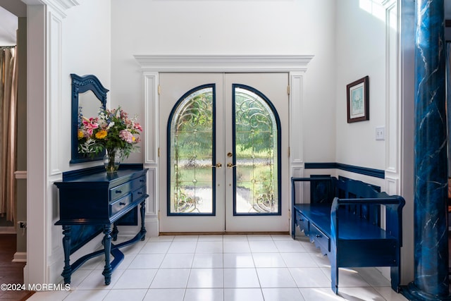 tiled foyer featuring french doors