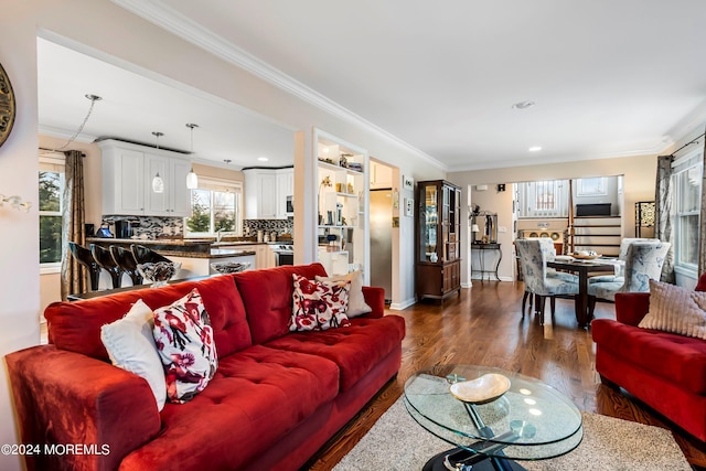 living area with recessed lighting, dark wood-style floors, and ornamental molding