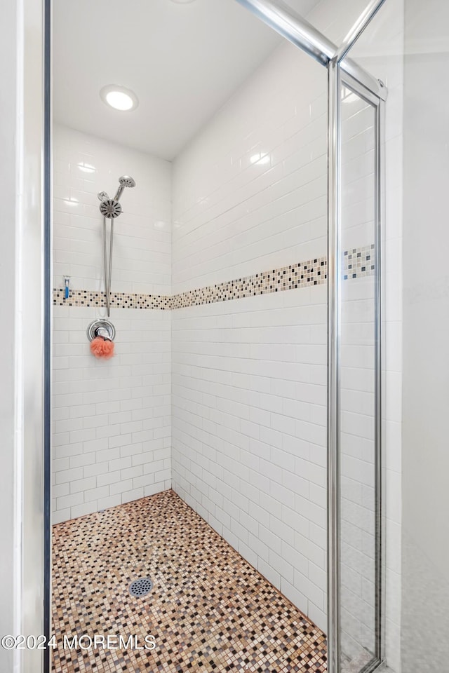 bathroom with a shower stall