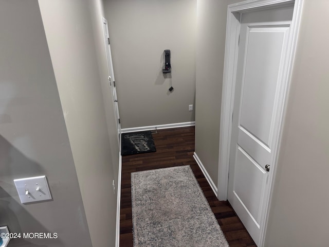 hall with dark hardwood / wood-style floors