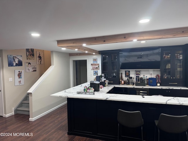 kitchen with light stone countertops and dark wood-type flooring