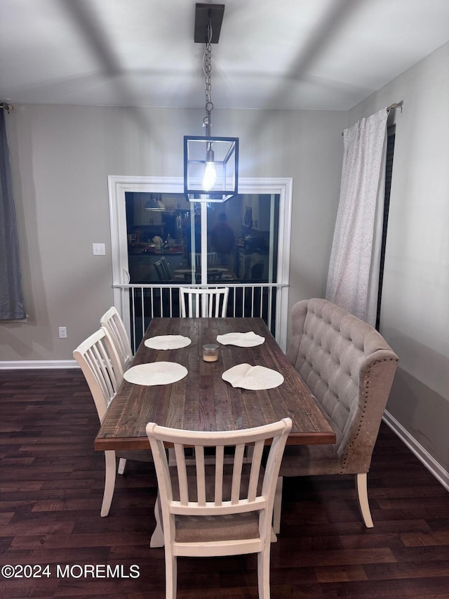 dining space featuring dark hardwood / wood-style flooring