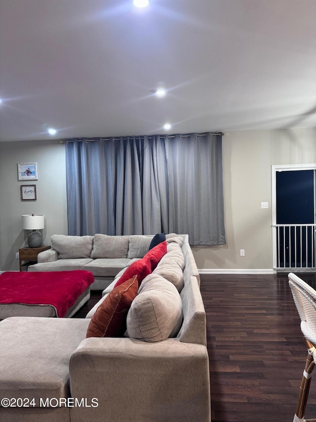 living room with dark hardwood / wood-style flooring