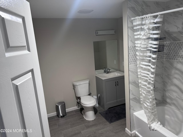 full bathroom featuring hardwood / wood-style floors, vanity, toilet, and shower / bathtub combination with curtain