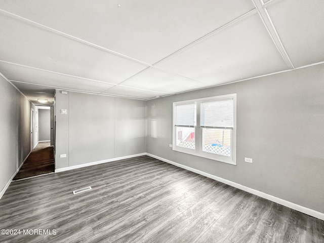 unfurnished room with hardwood / wood-style flooring