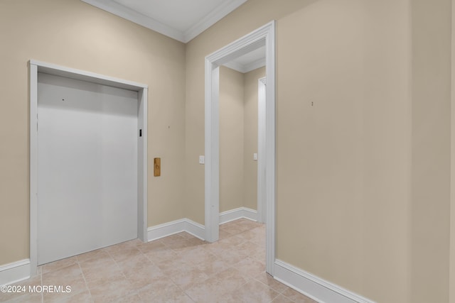 corridor with crown molding and elevator