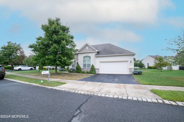 view of front facade featuring a front yard and a garage