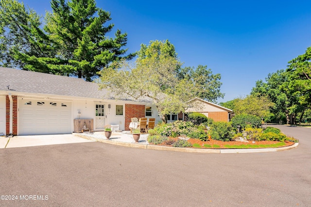 ranch-style home with a garage