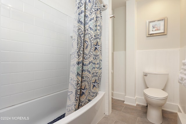 bathroom featuring shower / bath combo and toilet