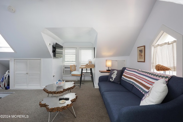 living room featuring cooling unit, lofted ceiling, and carpet floors