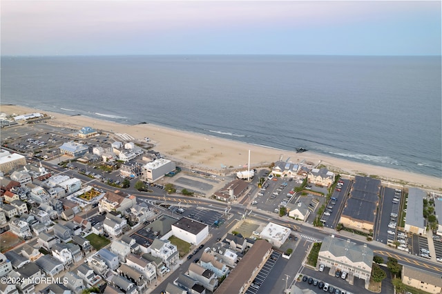 bird's eye view featuring a view of the beach and a water view