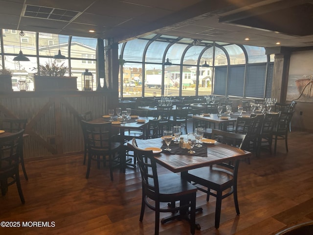 dining space with hardwood / wood-style floors