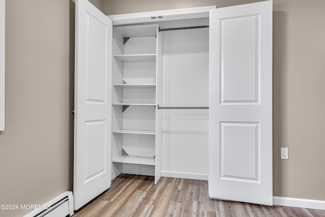 closet featuring baseboard heating