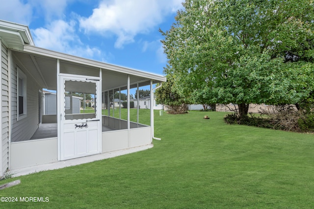 view of yard featuring a sunroom